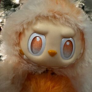 Happiness Big Into Energy Labubu comes with a free pair of croc-like shoes!